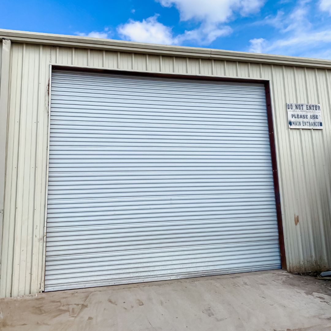 Commercial roll-up door on a metal building