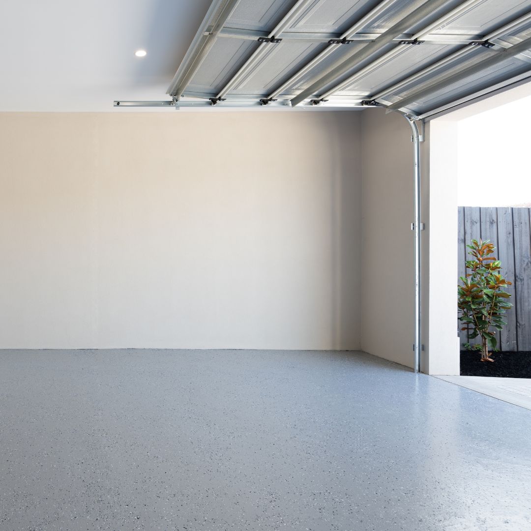 Inside a clean garage with the garage door fully open