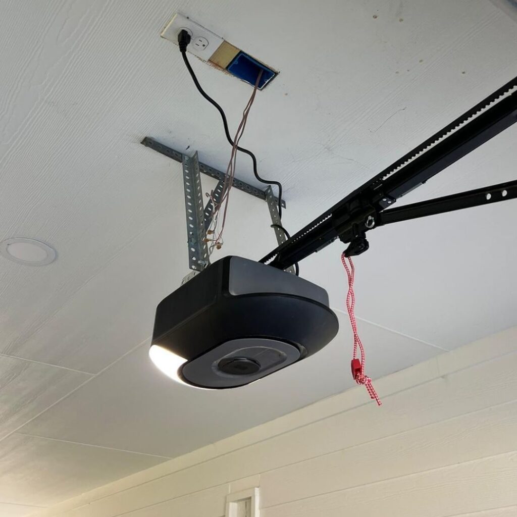 Ceiling-mounted smart garage door opener with a light