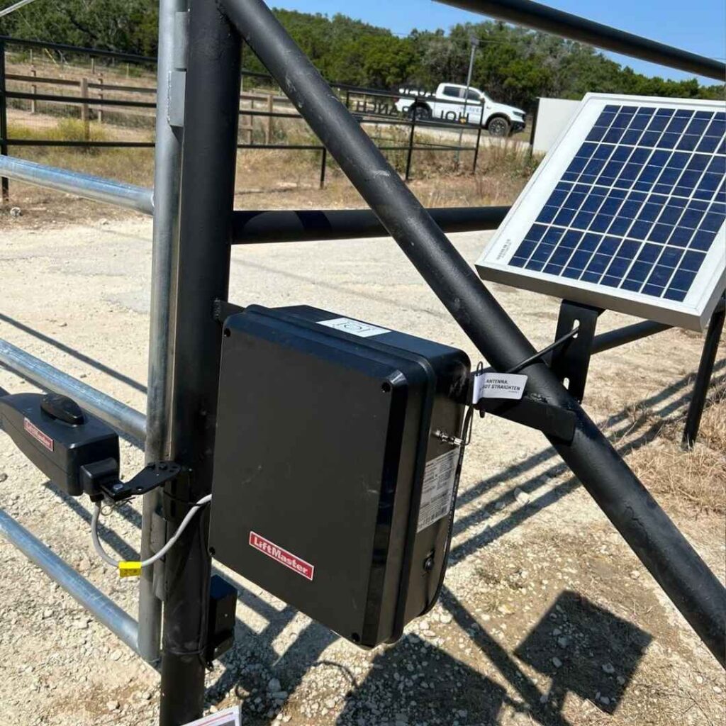 Solar panel and gate opener control box on a ranch gate