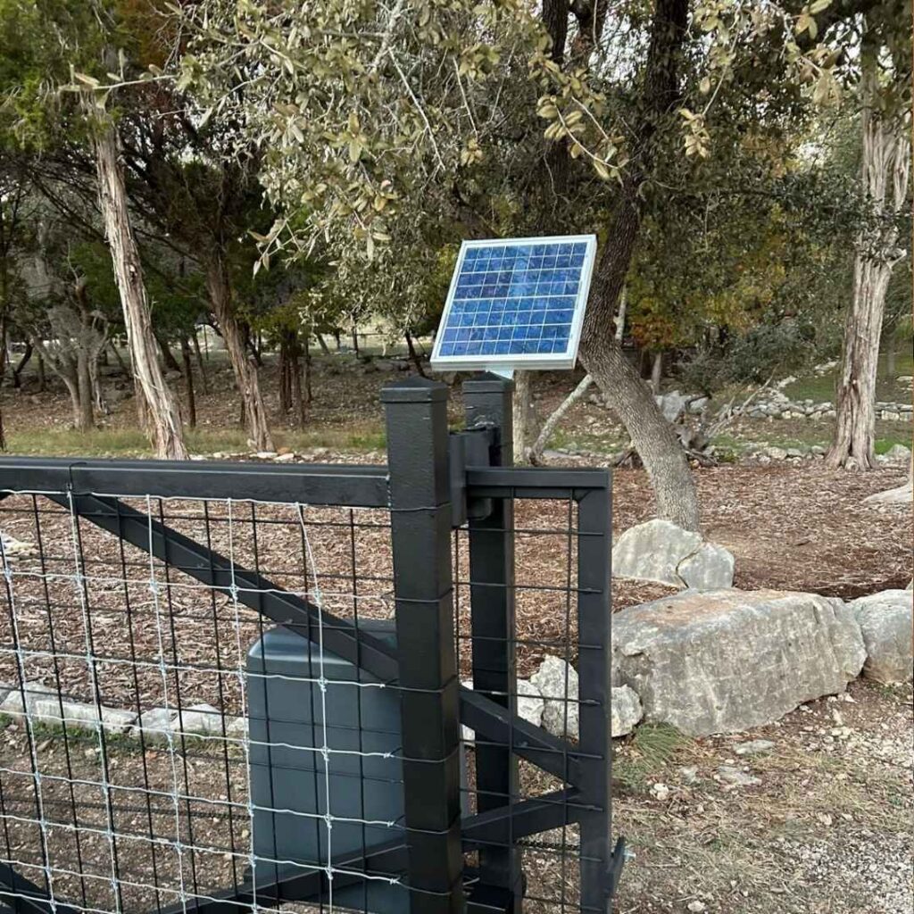 Solar-powered gate opener on a wire mesh ranch gate